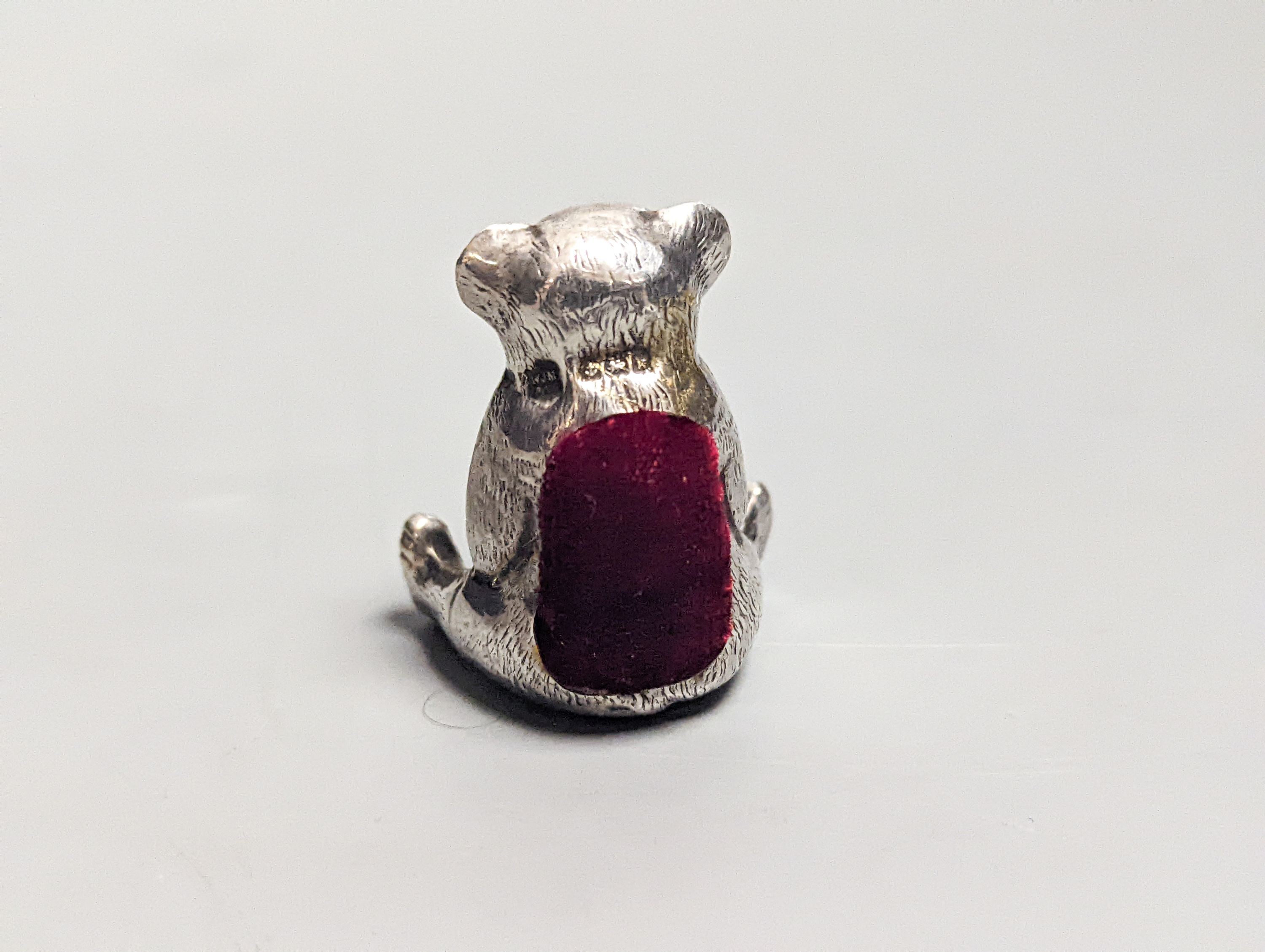 An Edwardian novelty silver 'teddy bear' pin cushion, with later cushion, W.J. Myott & Co, Birmingham, 1909, 36mm.